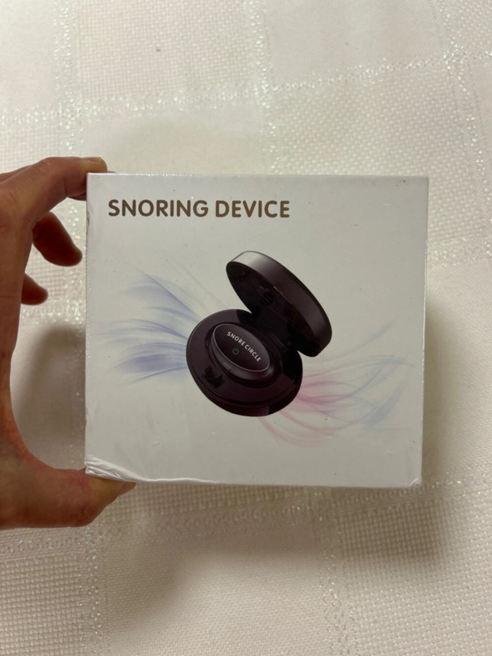 This is a SMART anti snoring device model ZHQ-017.